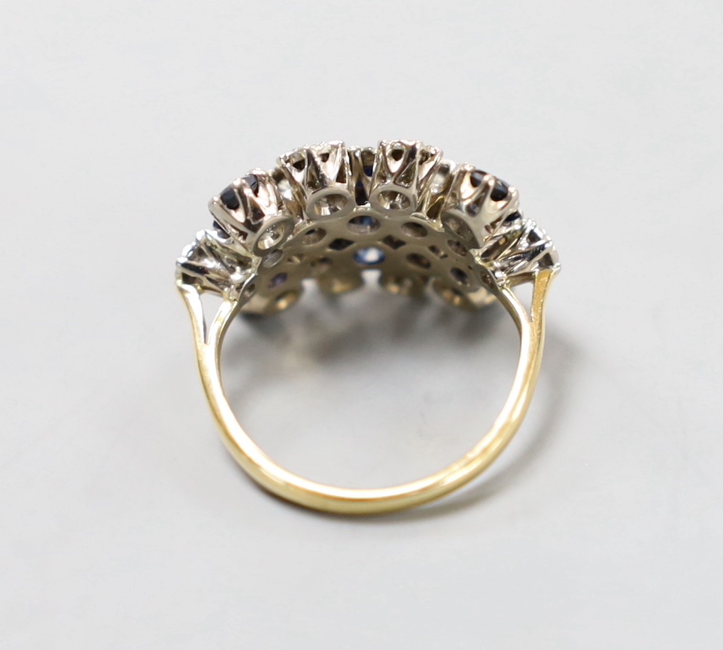 An 18ct, sapphire an diamond set cluster ring, size L/M, gross weight 6.5 grams.